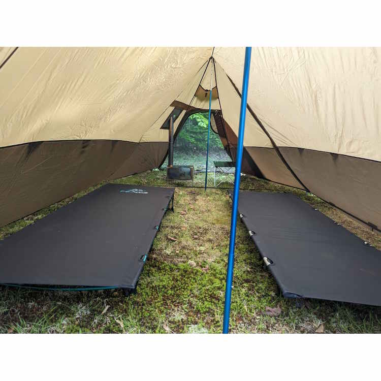 Luxe Twin Shelter shown with two cots and a stove.